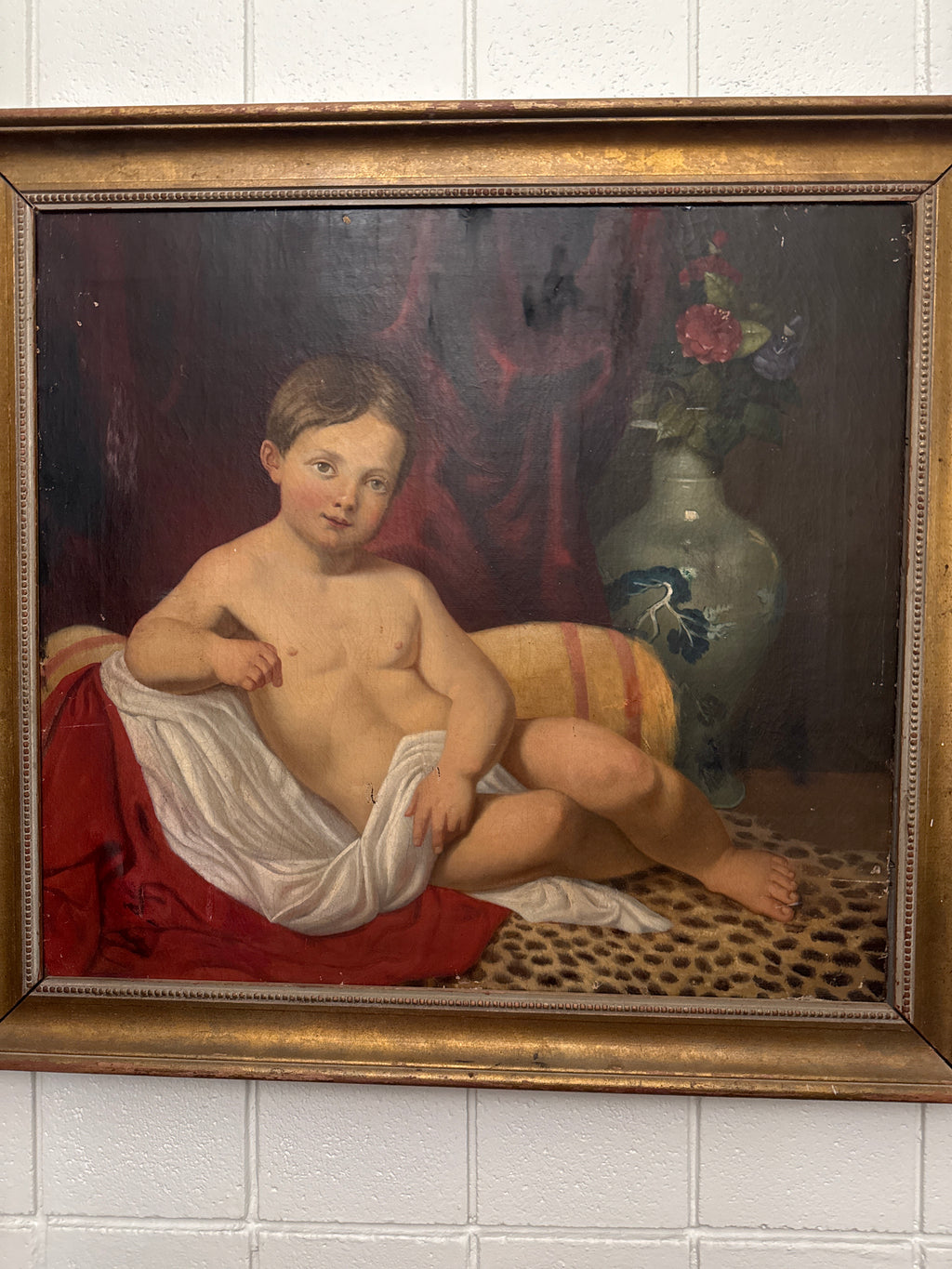 Antique Oil Painting – Reclining Child with Floral Vase
